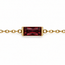 January birthstone-colour bracelet with a deep red rectangular faceted stone and polished gold-tone chain on white.
