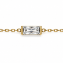April birthstone-colour bracelet with a clear rectangular faceted stone and polished gold-tone chain on white.