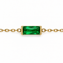 May birthstone-colour bracelet with a emerald green rectangular faceted stone and polished gold-tone chain on white.