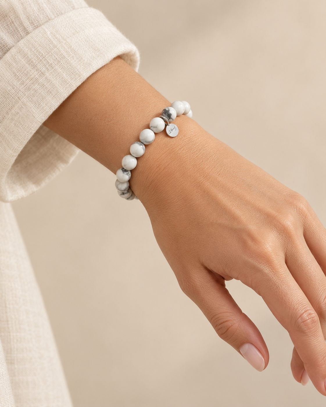 Howlite 8mm gemstone bracelet worn on a wrist
