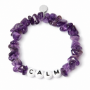Amethyst chipstone bracelet with white beads and black letters spelling CALM, shown as an example personalisation, with a blank silver tag