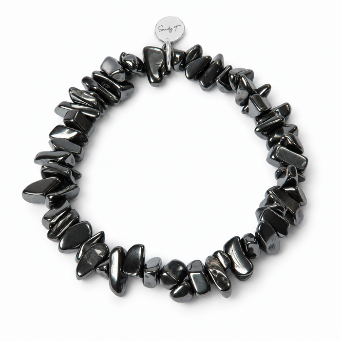 Hematite chipstone bracelet with a round sterling silver Sandy T signature tag on a white background.