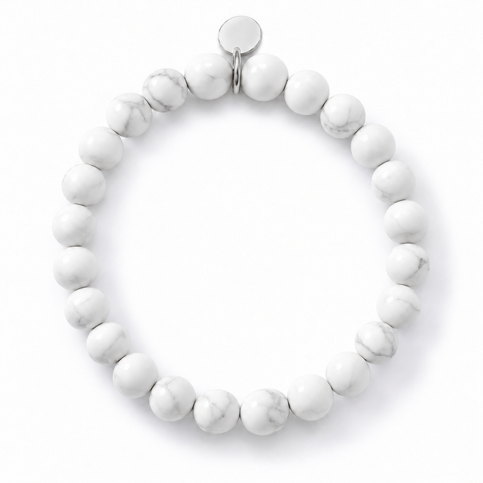 Howlite 6mm Round Stone Bracelet by Sandy T, shown on a white background, with a blank silver tag