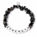 Onyx chipstone bracelet with white beads and black letters spelling STRENGTH, shown as an example personalisation, with a blank silver tag